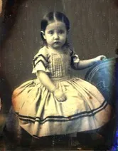 A black and white picture of Lucy Scribner as a young child