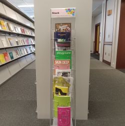 A vertical rack of magazines.